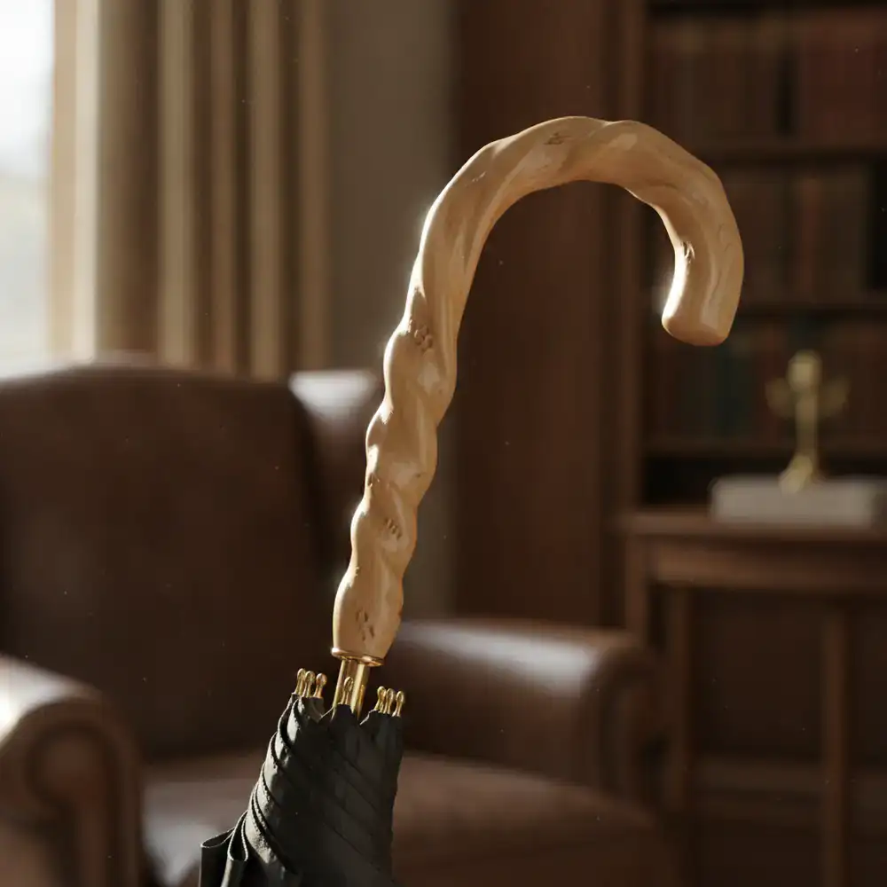 Detailed view of a hand-carved wooden umbrella handle